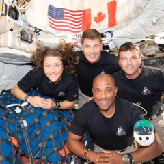 Orion capsule with astronauts returning to Earth