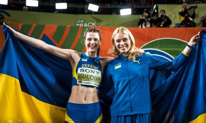 Ukrainian athletes on podium with medals