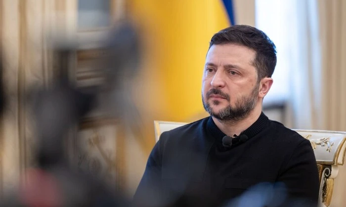 Zelensky signing documents in the office
