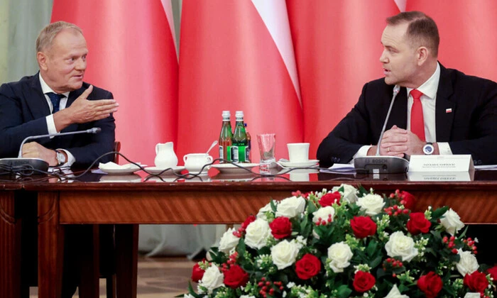 The President of Poland and Tusk in the background