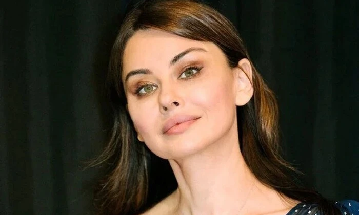 Actress Oksana Lada with a photo of her deceased brother