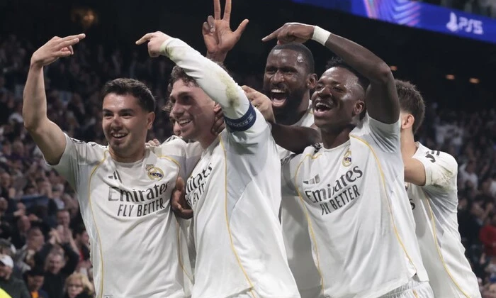 Real and Emirates logos