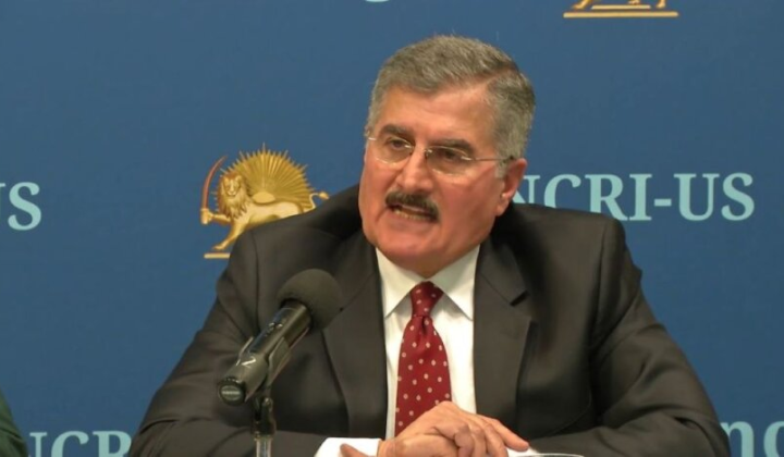 Iranian opposition leader speaking at a conference