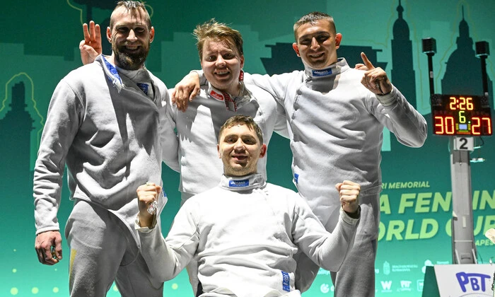 Ukrainian fencers on podium with medals