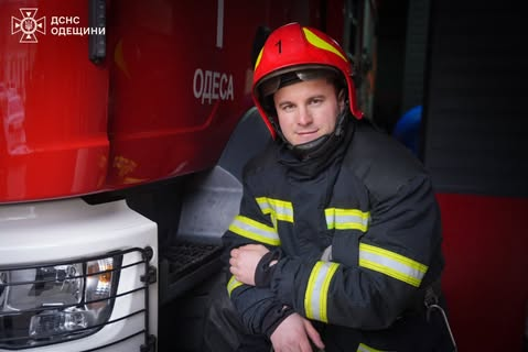 Emergency responder in front of rubble
