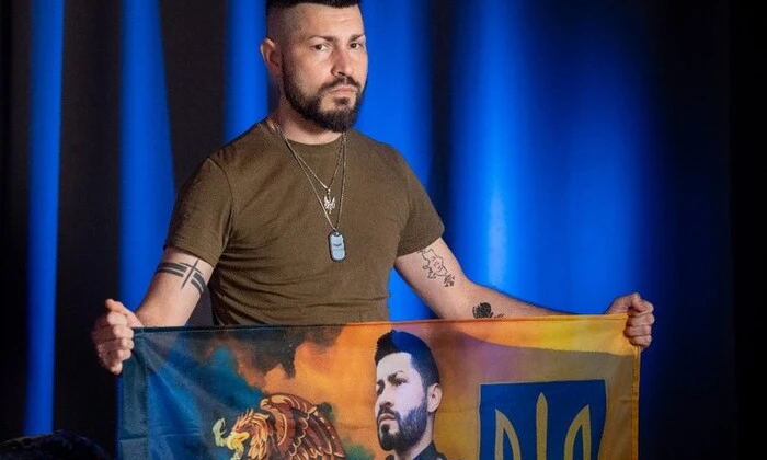Mexican Batman with Ukrainian flag in the background