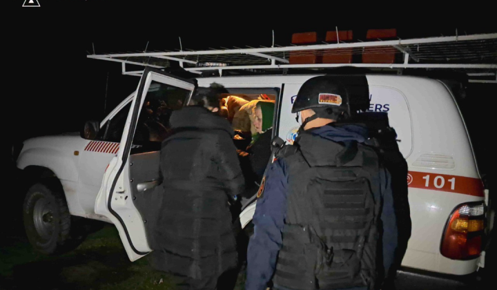 Rescuers evacuating people and cats