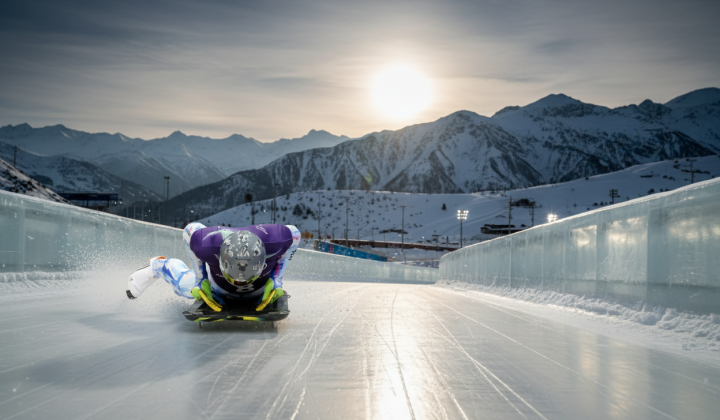 Skeleton athlete with helmet featuring portraits of deceased athletes