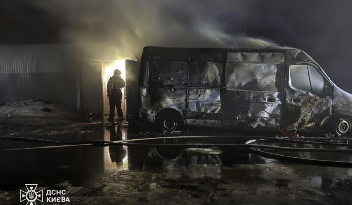 Fire engulfed trucks and warehouse